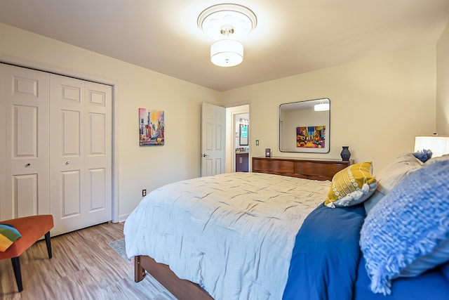 3185 Shadberry Ct, Saline, MI 48176 - bedroom featuring wood finished floors and a closet