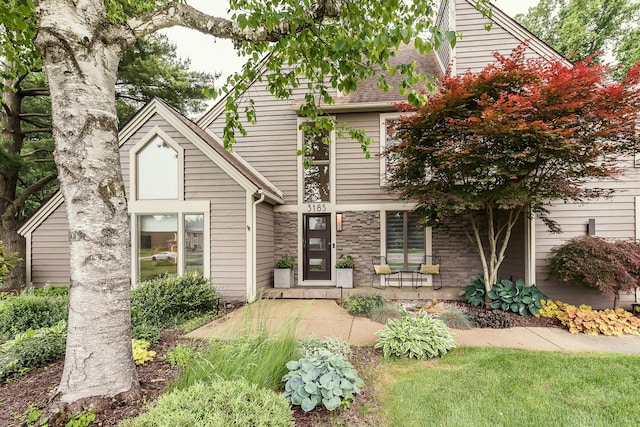 3185 Shadberry Ct, Saline, MI 48176 - view of front facade with roof with shingles and a porch