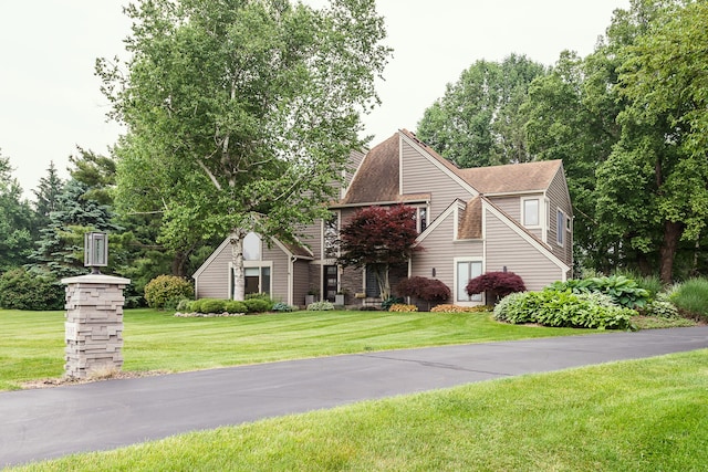 3185 Shadberry Ct, Saline, MI 48176 - view of front facade featuring a front yard and roof with shingles
