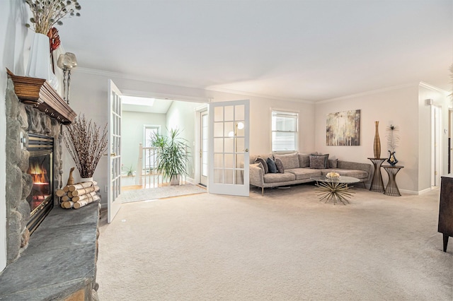 1775 Franklin Ct S, Ann Arbor, MI 48103 - carpeted living area featuring crown molding, a stone fireplace, and french doors