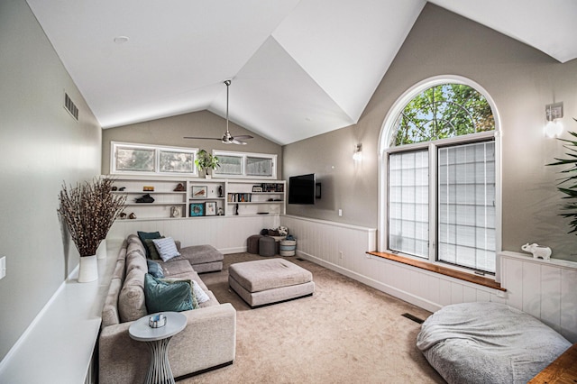 1775 Franklin Ct S, Ann Arbor, MI 48103 - carpeted living room featuring a wainscoted wall, lofted ceiling, and a ceiling fan