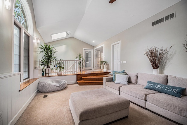1775 Franklin Ct S, Ann Arbor, MI 48103 - carpeted living room featuring a skylight and lofted ceiling