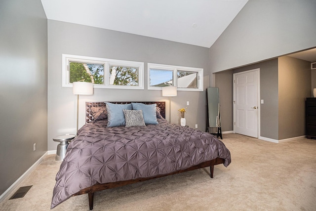 1775 Franklin Ct S, Ann Arbor, MI 48103 - carpeted bedroom with baseboards and high vaulted ceiling