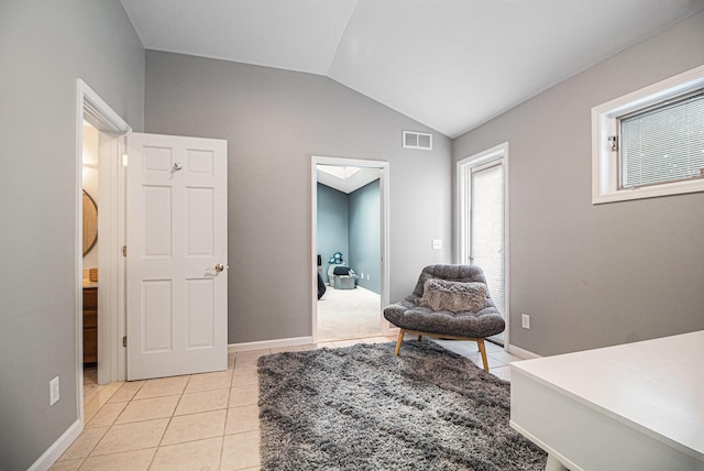 1775 Franklin Ct S, Ann Arbor, MI 48103 - living area with vaulted ceiling and light tile patterned floors