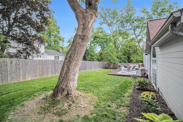1775 Franklin Ct S, Ann Arbor, MI 48103 - fenced backyard with a wooden deck and an outdoor living space