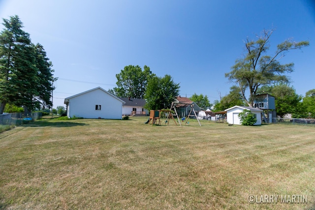 641 52nd St SE, Grand Rapids, MI 49548 - fenced backyard featuring a playground and a shed