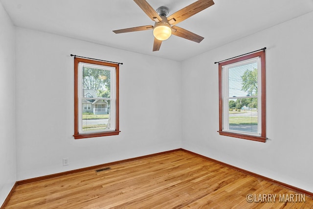641 52nd St SE, Grand Rapids, MI 49548 - unfurnished room with light wood-type flooring and ceiling fan
