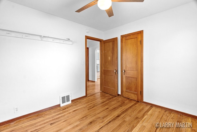 641 52nd St SE, Grand Rapids, MI 49548 - unfurnished bedroom with light wood-style floors and a ceiling fan