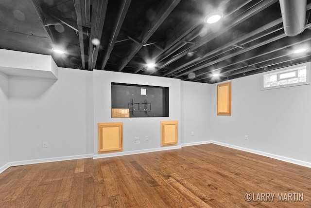 641 52nd St SE, Grand Rapids, MI 49548 - below grade area with wood finished floors and baseboards