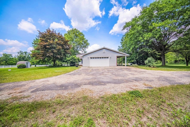6990 Kennedy Rd, Munith, MI 49259 - view of side of home with an outbuilding