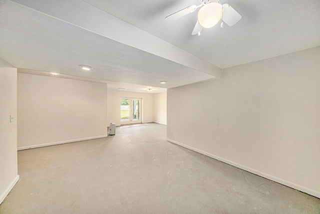 6990 Kennedy Rd, Munith, MI 49259 - spare room featuring concrete flooring and a ceiling fan