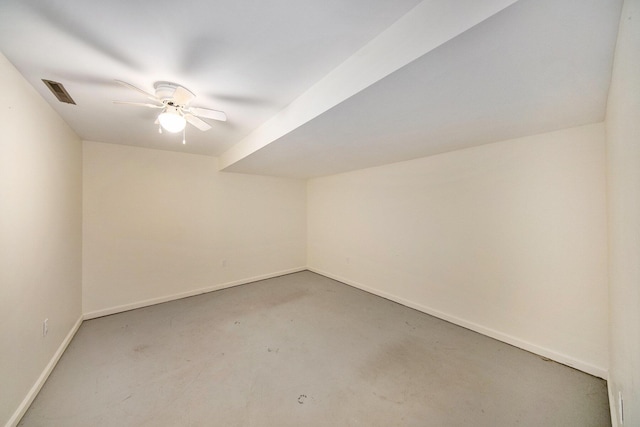 6990 Kennedy Rd, Munith, MI 49259 - additional living space with concrete flooring and a ceiling fan