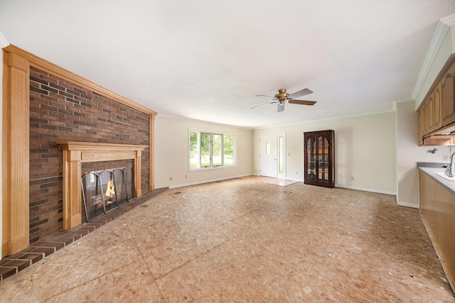 6990 Kennedy Rd, Munith, MI 49259 - unfurnished living room with ceiling fan, a brick fireplace, and ornamental molding