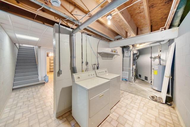 6990 Kennedy Rd, Munith, MI 49259 - basement featuring water heater, separate washer and dryer, stairs, brick patterned flooring, and heating unit