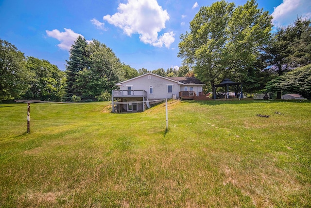 6990 Kennedy Rd, Munith, MI 49259 - view of green lawn with a gazebo and a deck