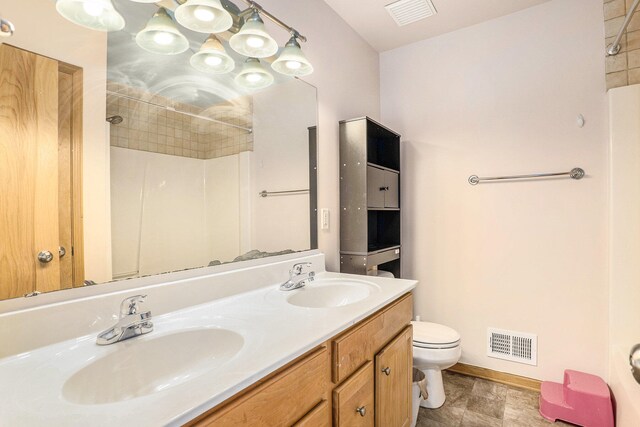 5767 E Grove Dr SE, Kentwood, MI 49512 - full bathroom with a shower and double vanity
