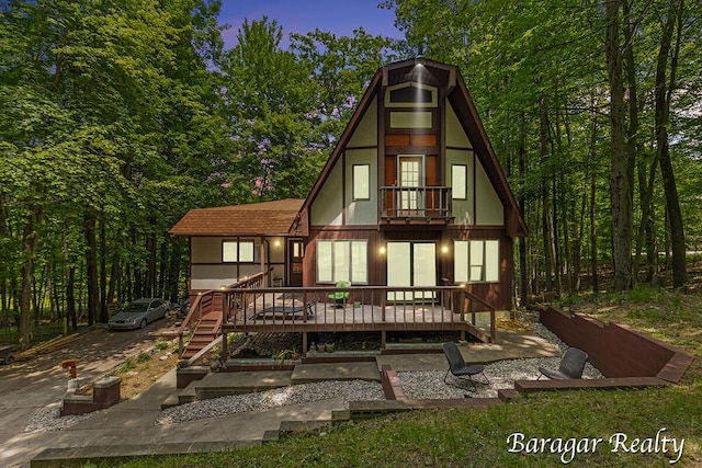 9550 Pere Marquette Dr, Stanwood, MI 49346 - back of house featuring a balcony and a wooden deck
