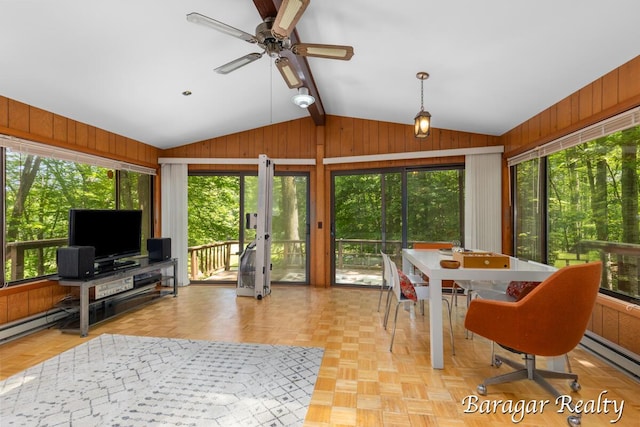 9550 Pere Marquette Dr, Stanwood, MI 49346 - living area with lofted ceiling, wood walls, ceiling fan, french doors, and a baseboard radiator