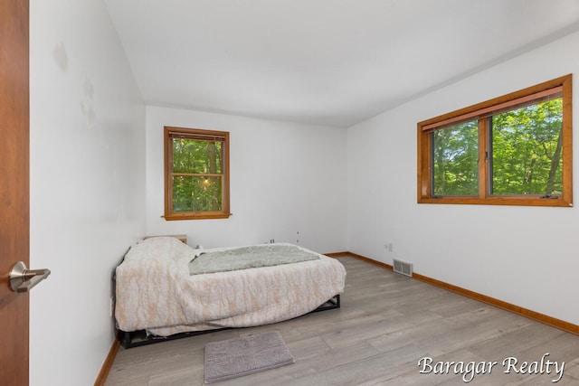 9550 Pere Marquette Dr, Stanwood, MI 49346 - bedroom with light wood-style floors and baseboards