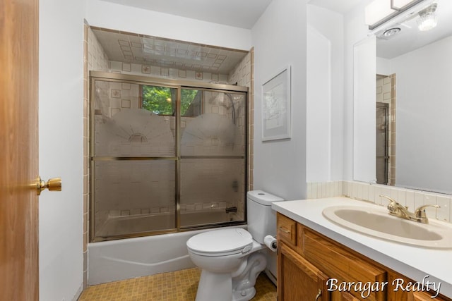 9550 Pere Marquette Dr, Stanwood, MI 49346 - bathroom featuring vanity and shower / bath combination with glass door