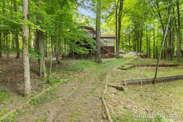 9550 Pere Marquette Dr, Stanwood, MI 49346 - view of yard with stairway and a deck