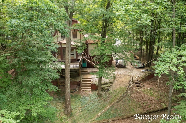 9550 Pere Marquette Dr, Stanwood, MI 49346 - view of play area featuring stairs and a deck