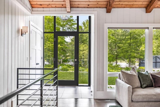 16128 Walnut Ct, Three Oaks, MI 49128 - doorway featuring a wooden ceiling with exposed beams, plenty of natural light, wood finished floors, and wood walls