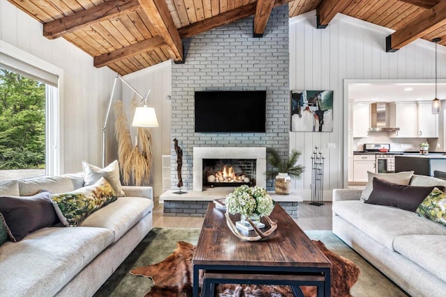 16128 Walnut Ct, Three Oaks, MI 49128 - living area with wood finished floors, wood ceiling, a fireplace, and wood walls