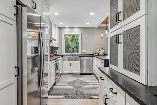16128 Walnut Ct, Three Oaks, MI 49128 - kitchen with stainless steel appliances, recessed lighting, dark wood-type flooring, and white cabinets