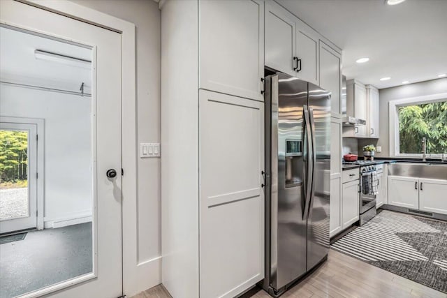 16128 Walnut Ct, Three Oaks, MI 49128 - kitchen featuring stainless steel appliances, light wood-type flooring, recessed lighting, and white cabinetry