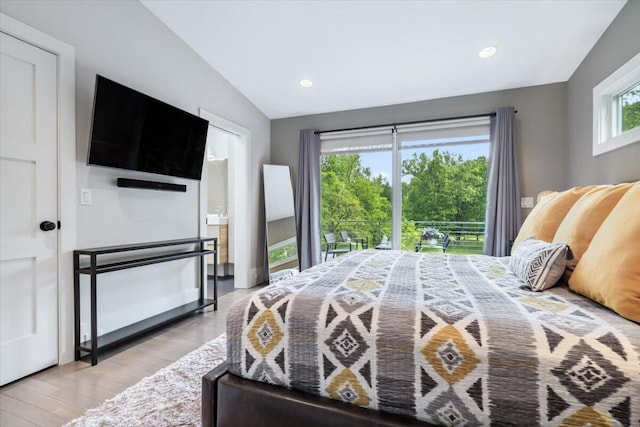 16128 Walnut Ct, Three Oaks, MI 49128 - bedroom with light wood-style floors, vaulted ceiling, and recessed lighting