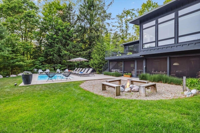 16128 Walnut Ct, Three Oaks, MI 49128 - view of green lawn featuring a patio area, an outdoor pool, and an outdoor fire pit