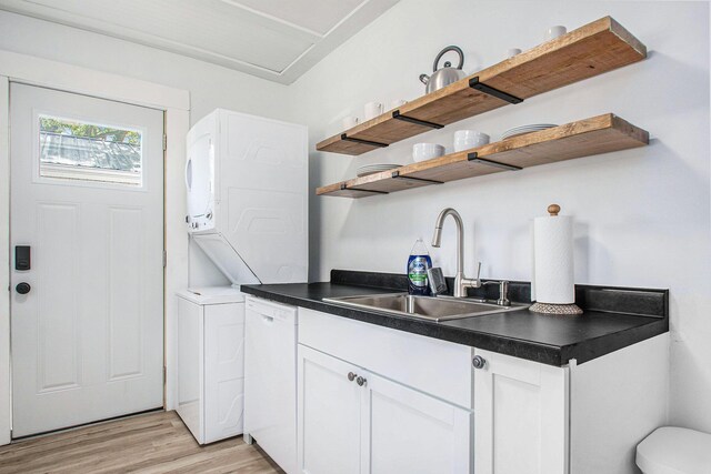 501 Sherwood Ave, Three Oaks, MI 49128 - kitchen with open shelves, dishwasher, dark countertops, and light wood-style floors