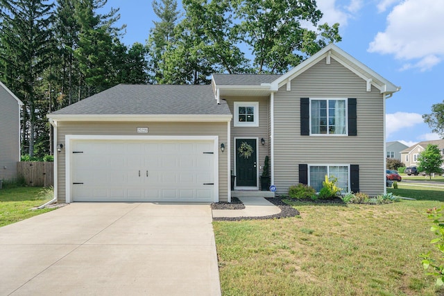 25220 Forest Ln, Mattawan, MI 49071 - split level home with driveway, an attached garage, and roof with shingles