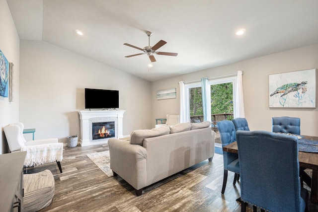 25220 Forest Ln, Mattawan, MI 49071 - living area featuring lofted ceiling, ceiling fan, wood finished floors, a glass covered fireplace, and recessed lighting