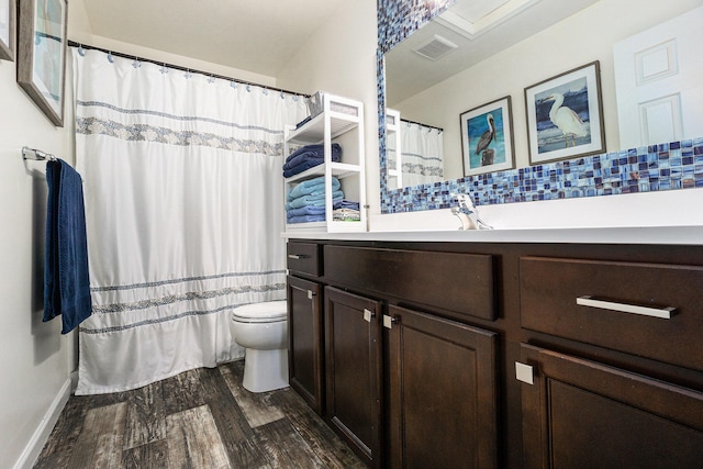 25220 Forest Ln, Mattawan, MI 49071 - full bath featuring wood finished floors, vanity, decorative backsplash, and a shower with curtain