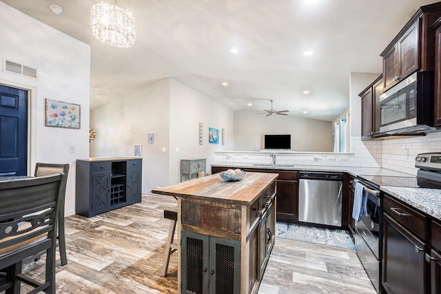 25220 Forest Ln, Mattawan, MI 49071 - kitchen with appliances with stainless steel finishes, wooden counters, a ceiling fan, dark brown cabinetry, and decorative backsplash