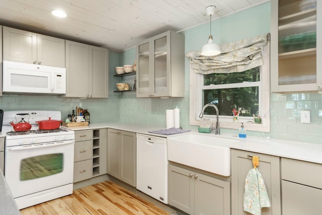 2821 Lakeshore Rd, Lexington, MI 48450 - kitchen featuring white appliances, decorative backsplash, light countertops, light wood-style floors, and wooden ceiling