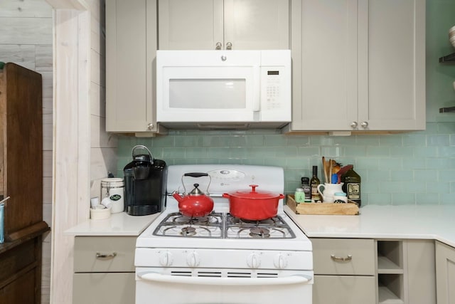 2821 Lakeshore Rd, Lexington, MI 48450 - kitchen featuring white appliances, tasteful backsplash, and light countertops