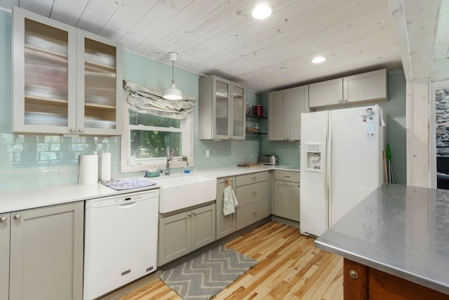 2821 Lakeshore Rd, Lexington, MI 48450 - kitchen with white appliances, gray cabinets, wooden ceiling, light wood-type flooring, and decorative backsplash