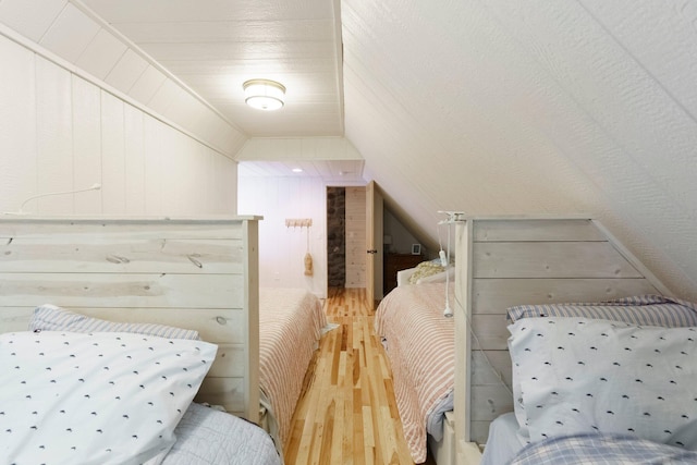 2821 Lakeshore Rd, Lexington, MI 48450 - bedroom featuring wood finished floors and vaulted ceiling