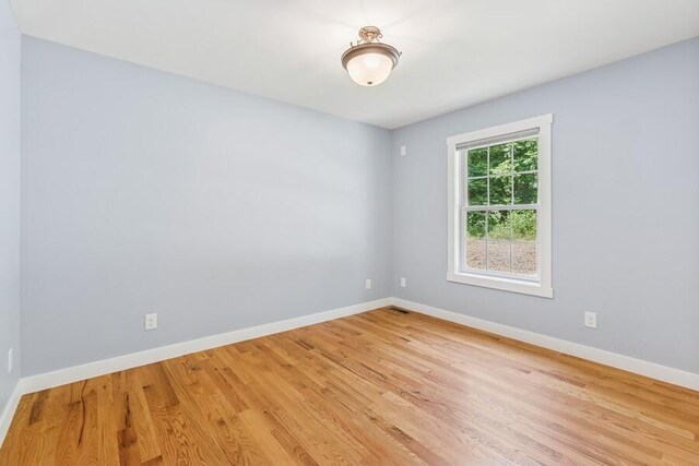 450 Carefree Ct, Niles, MI 49120 - empty room with baseboards and wood finished floors