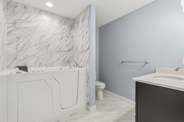 450 Carefree Ct, Niles, MI 49120 - bathroom featuring marble finish floors, vanity, a tub, washer / clothes dryer, and recessed lighting