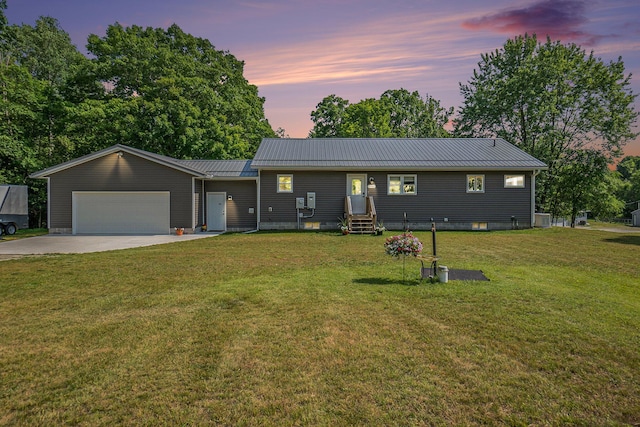 2480 S 148th Ave, Hesperia, MI 49421 - ranch-style home featuring entry steps, a metal roof, driveway, an attached garage, and a front yard