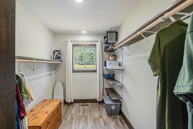 2480 S 148th Ave, Hesperia, MI 49421 - walk in closet featuring wood finished floors