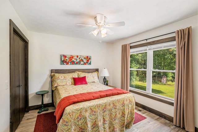 2480 S 148th Ave, Hesperia, MI 49421 - bedroom with light wood-style floors and a ceiling fan