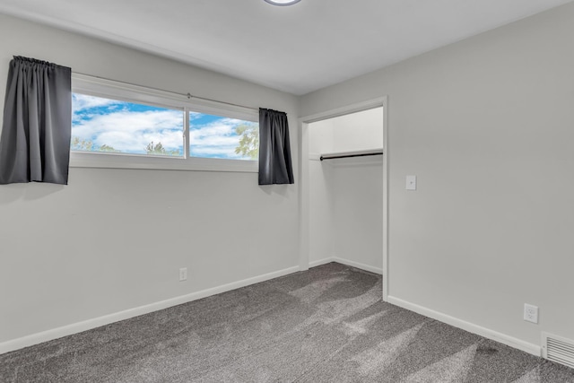 2200 Lindsey Rd, Jackson, MI 49201 - unfurnished bedroom with dark carpet and a closet