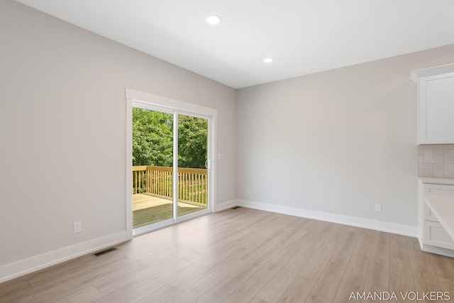 6322 Sheldon Dr, Hudsonville, MI 49426 - empty room with light wood-style flooring and recessed lighting