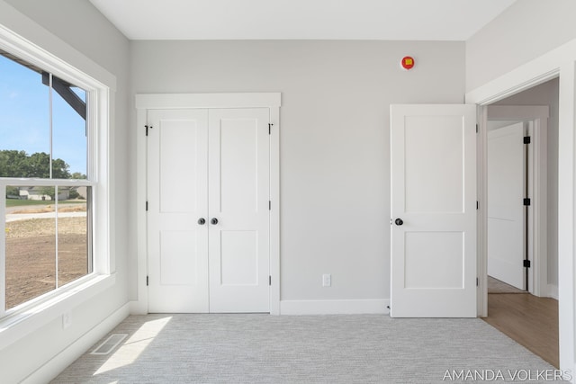 6322 Sheldon Dr, Hudsonville, MI 49426 - unfurnished bedroom featuring a closet and baseboards