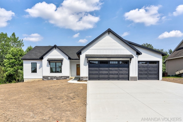 6322 Sheldon Dr, Hudsonville, MI 49426 - modern farmhouse with a shingled roof, board and batten siding, and driveway